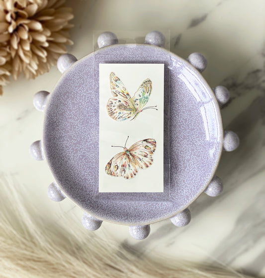 Close view of double butterfly temporary tattoo โ 2 x 4 inches
