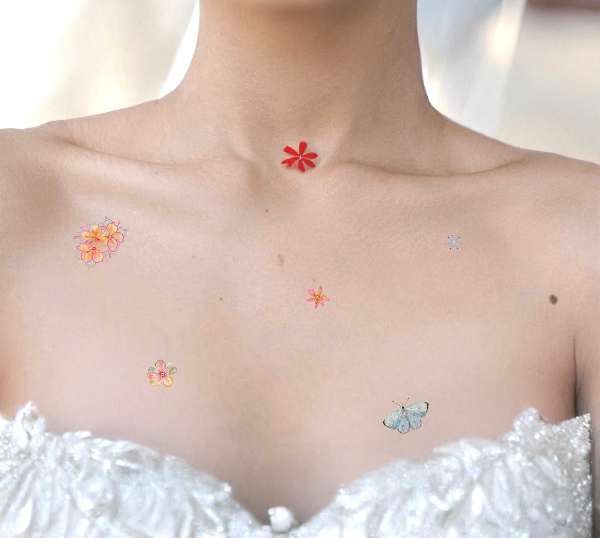 Close-up of a bride with temporary tattoos on her chest and neck.